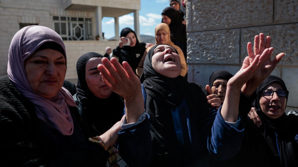 Mourners react during the funeral of three Palestinians who were killed in an Israeli settler attack, in the village of Abu Falah near Ramallah, in the Israeli-occupied West Bank, March 8, 2026. (Reuters Photo)