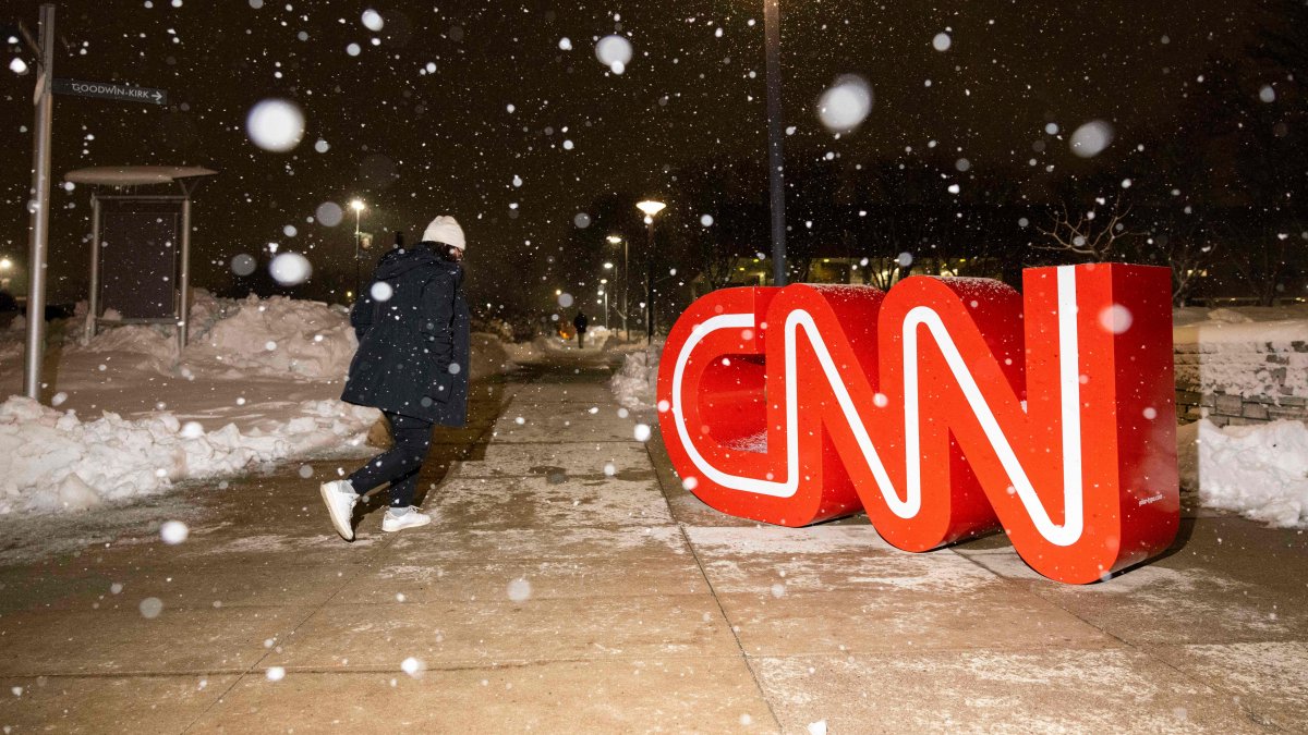 The CNN logo is seen as snow falls, Des Moines, Iowa, U.S., Jan. 10, 2024. (AFP Photo)