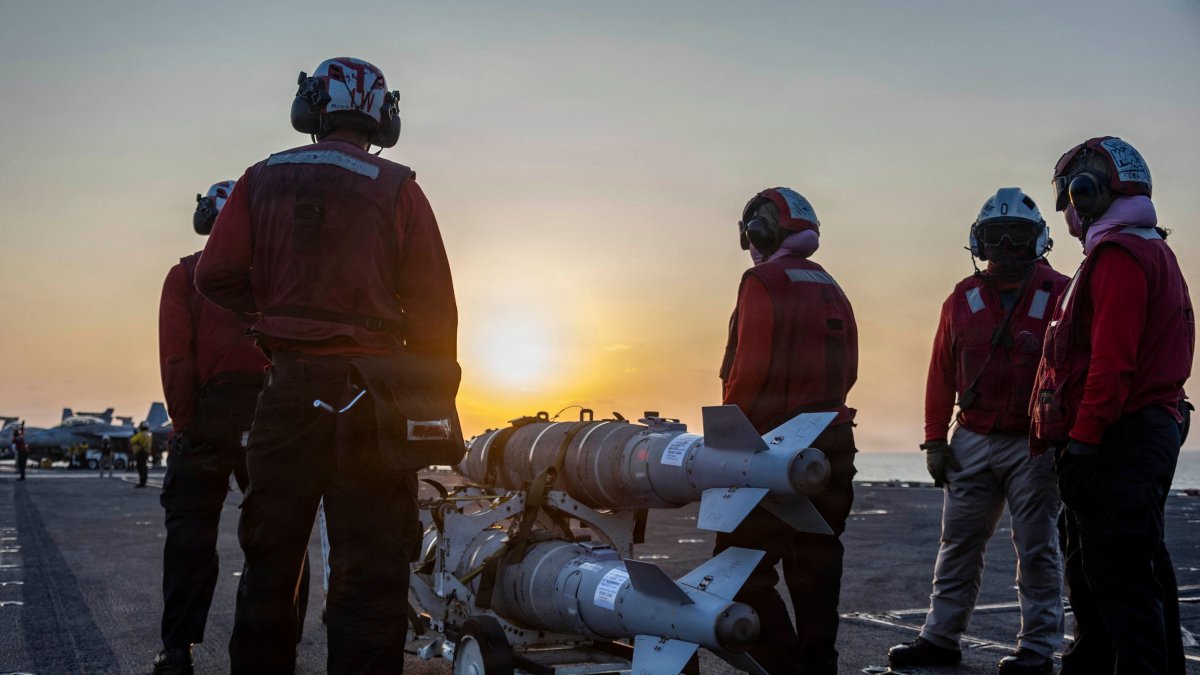 This US Navy handout photo released on March 6, 2026, by US Central Command Public Affairs shows US sailors preparing ordnance on the flight deck of Nimitz-class aircraft carrier USS Abraham Lincoln (CVN 72) in support of "Operation Epic Fury", March 4, 2026. (AFP Photo)