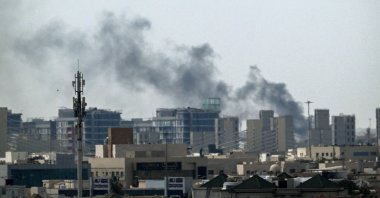 A plume of smoke rises over buildings, Doha, Qatar, March 5, 2026. (AFP Photo)