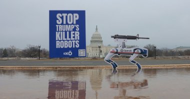 AI robot signs are planted into the ground on the National Mall in an act of protest against OpenAI’s decision to allow the Pentagon to use its AI technologies, Washington, U.S., March 6, 2026. (AFP Photo)