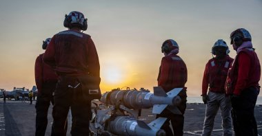 This US Navy handout photo released on March 6, 2026, by US Central Command Public Affairs shows US sailors preparing ordnance on the flight deck of Nimitz-class aircraft carrier USS Abraham Lincoln (CVN 72) in support of "Operation Epic Fury", March 4, 2026. (AFP Photo)