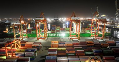 A drone view of an Evergreen container ship docked at the port of Umm Qasr during nighttime operations in Basra, Iraq, March 5, 2026. (Reuters Photo)