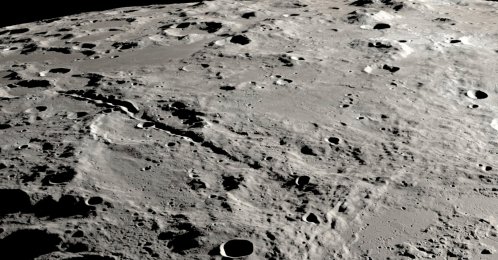 This undated photo provided by NASA shows a view from orbit looking at the surface of the moon. (AP Photo)