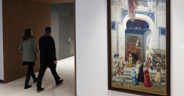People walk past "Cami Kapısında” ("At the Mosque Door") by Osman Hamdi Bey during a press preview at Bonham’s in New York City, U.S., Feb. 9, 2026. (AFP Photo)