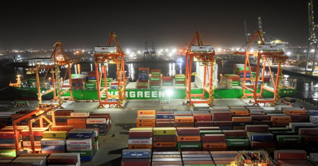 A drone view of an Evergreen container ship docked at the port of Umm Qasr during nighttime operations in Basra, Iraq, March 5, 2026. (Reuters Photo)