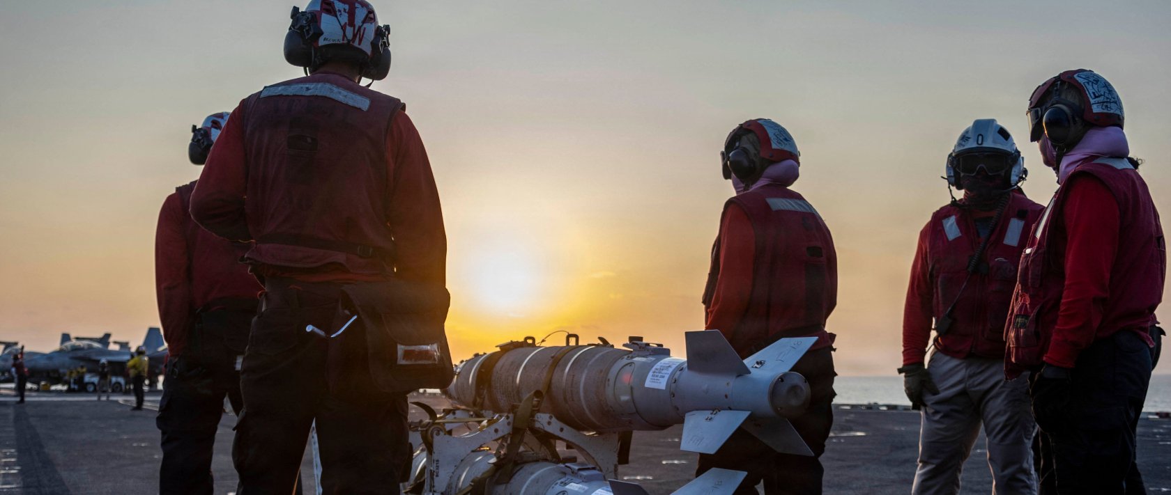 This US Navy handout photo released on March 6, 2026, by US Central Command Public Affairs shows US sailors preparing ordnance on the flight deck of Nimitz-class aircraft carrier USS Abraham Lincoln (CVN 72) in support of "Operation Epic Fury", March 4, 2026. (AFP Photo)