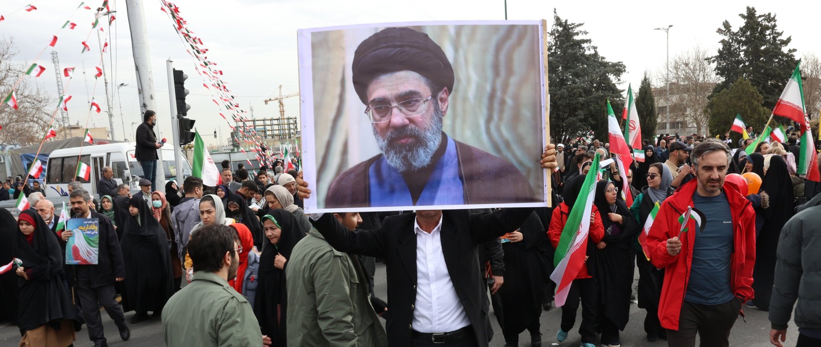 An Iranian man holds a picture of Mojtaba Khamenei, the son of the Iranian Supreme Leader, as he takes part in celebrations of the 47th anniversary of the Islamic Revolution in Tehran, Iran, Feb. 11, 2026. (EPA Photo)