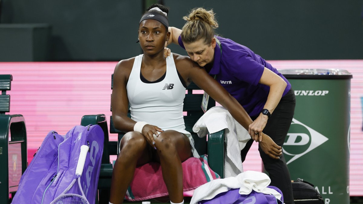 U.S' Coco Gauff receives physio treatment before retiring from her women’s singles match against the Philippines' Alexandra Eala on day 5 of the BNP Paribas Open tennis tournament, Indian Wells, U.S., March 8, 2026. (EPA Photo)
