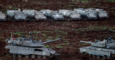 Israeli tanks and armoured personnel carriers on the Israeli side of the Israel-Lebanon border, following an escalation between Hezbollah and Israel amid the U.S.-Israeli conflict with Iran, northern Israel, March 8, 2026. (Reuters Photo)