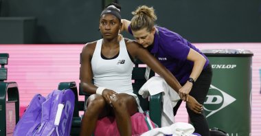 U.S' Coco Gauff receives physio treatment before retiring from her women’s singles match against the Philippines' Alexandra Eala on day 5 of the BNP Paribas Open tennis tournament, Indian Wells, U.S., March 8, 2026. (EPA Photo)