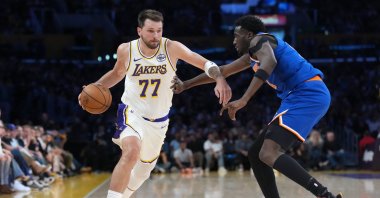 Los Angeles Lakers guard Luka Doncic (L) dribbles against New York Knicks forward Mohamed Diawara during the second half at Crypto.com Arena, Los Angeles, U.S., March 8, 2026. (Reuters Photo)