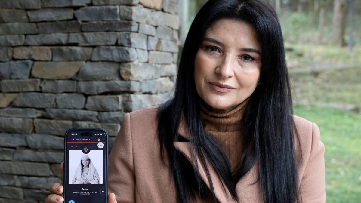 Albanian actress Anila Bisha poses with the AI-generated chatbot named "Diella," Tirana, Albania, Feb. 19, 2026. (AFP Photo)