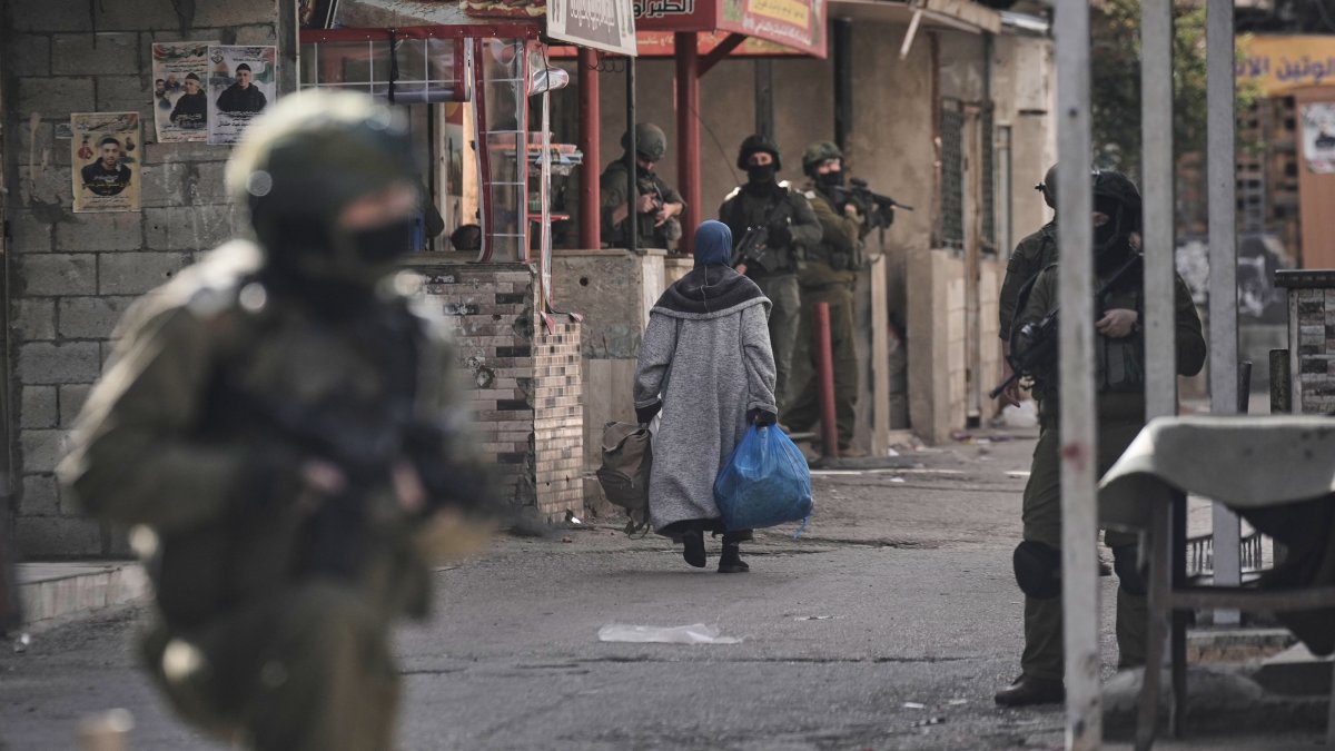 This file photo shows Israeli soldiers taking positions during a military operation in the Balata refugee camp in the occupied West Bank, Palestine, Feb. 1, 2026. (AP Photo)