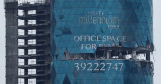 A building damaged in a reported Iranian drone strike, amid the U.S.-Israeli conflict with Iran, in Seef, Manama, Bahrain, March 10, 2026. (Reuters Photo)