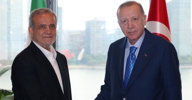 President Recep Tayyip Erdoğan and Iranian President Masoud Pezeshkian shake hands at the Turkish House, New York, U.S., Sept. 23, 2024. (DHA Photo)