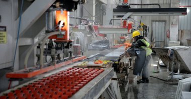A worker is photographed in a factory producing marble, Muğla, southwestern Türkiye, Feb. 13, 2026. (AA Photo)