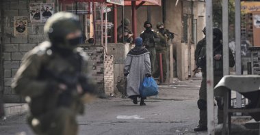 This file photo shows Israeli soldiers taking positions during a military operation in the Balata refugee camp in the occupied West Bank, Palestine, Feb. 1, 2026. (AP Photo)