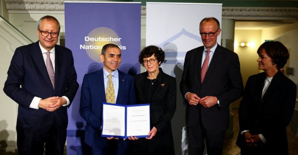 BioNTech founders Uğur Şahin (2nd L) and Özlem Türeci (C) are awarded at the German National Prize 2025, as they stand next to German Chancellor Friedrich Merz (2nd R), Berlin, Germany, June 10, 2025. (Reuters Photo)