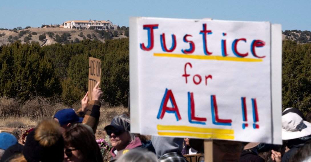 Zorro Ranch, a property formerly owned by Jeffrey Epstein, stands behind a protest sign that reads "Justice for all" on International Women’s Day near Stanley, New Mexico, U.S., March 8, 2026. (Reuters Photo)