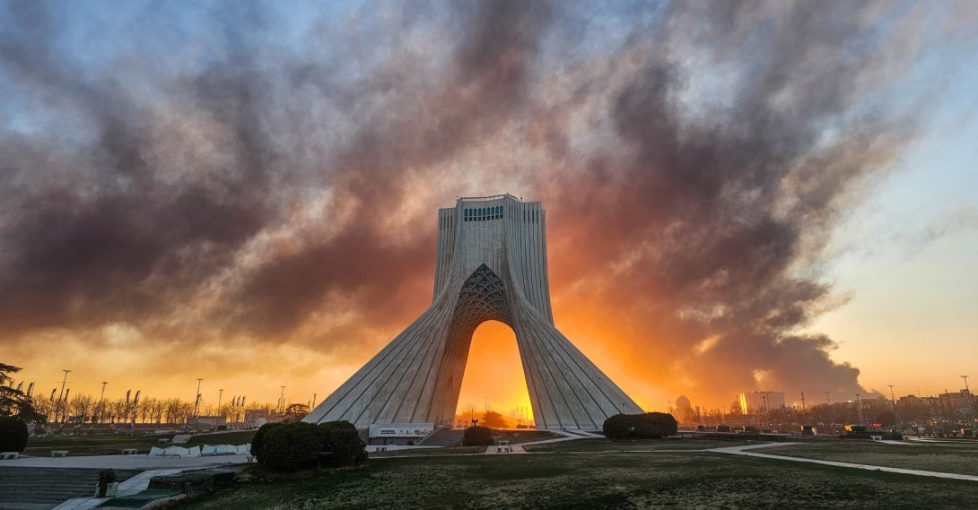 Smoke rises behind the Azadi (Freedom) monument in Tehran following the U.S.-Israeli military attack, Iran, March 3, 2026. (AP File Photo)