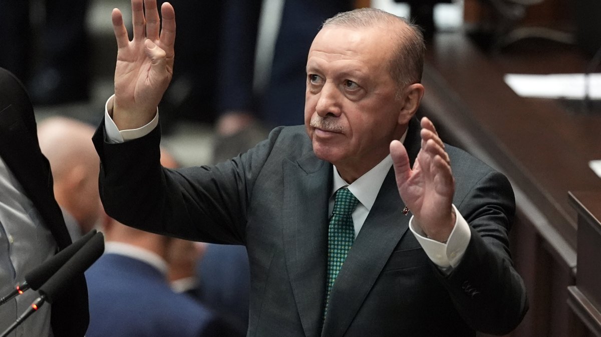 President Recep Tayyip Erdoğan greets party members during the party’s parliamentary group meeting at Parliament, Ankara, Türkiye, March 11, 2026. (AA Photo)
