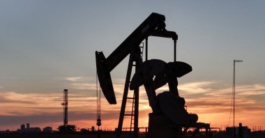 A drone view of a pump jack and drilling rig south of Midland, Texas, U.S., June 11, 2025. (Reuters Photo)