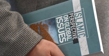 A copy of "Islamic Perspective on Global Issues" on display, highlighting Diyanet’s multilingual publications, Ankara, Türkiye, March 6, 2026. (AA Photo)