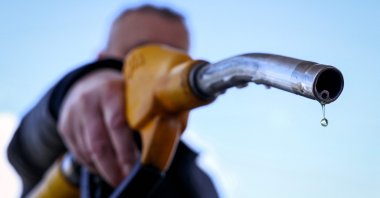 A drop of petrol falls from the nozzle of a petrol pump at a petrol station in Velizy-Villacoublay, near Paris, France, March 9, 2026. (AFP Photo)
