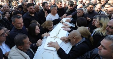 Residents of the Christian Lebanese border village of Qlayaa mourn over the coffin of their village's priest, Father Pierre al-Rahi during his funeral, Lebanon, March 11, 2026. (AFP Photo)