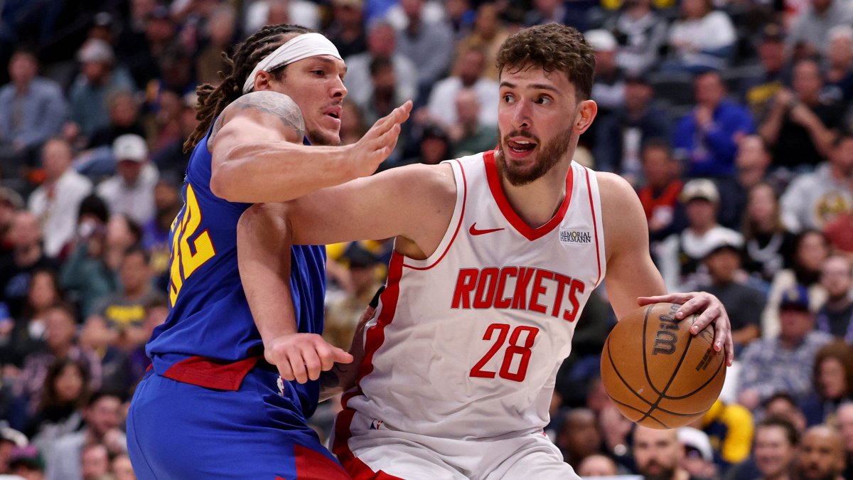 Houston Rockets' Alperen Şengün (R) drives against Denver Nuggets' Aaron Gordon during the second half at Ball Arena, Denver, U.S., March 11, 2026. (AFP Photo)