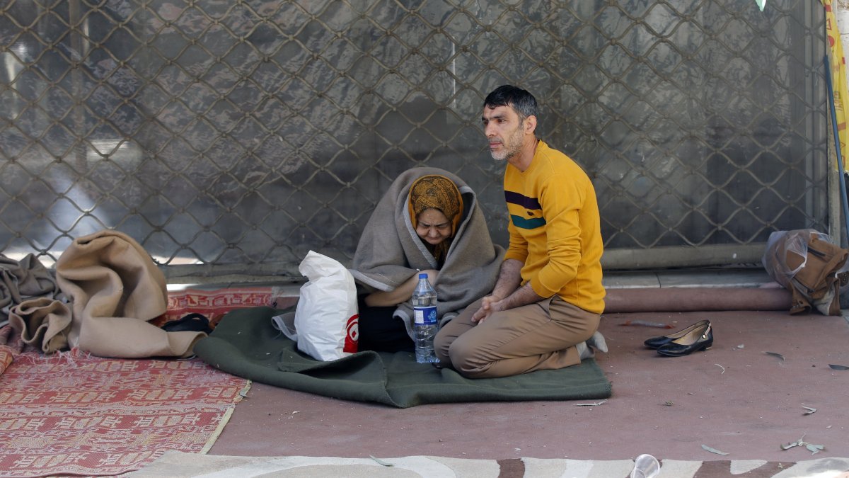 Displaced Iranians are seen near their house after it was destroyed in a U.S.-Israeli attack on Tehran, Iran, Feb. 28, 2026. (AA Photo)