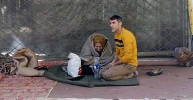 Displaced Iranians are seen near their house after it was destroyed in a U.S.-Israeli attack on Tehran, Iran, Feb. 28, 2026. (AA Photo)