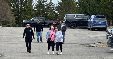 People gather near Temple Israel synagogue in West Bloomfield Township, Mich. (AP Photo)