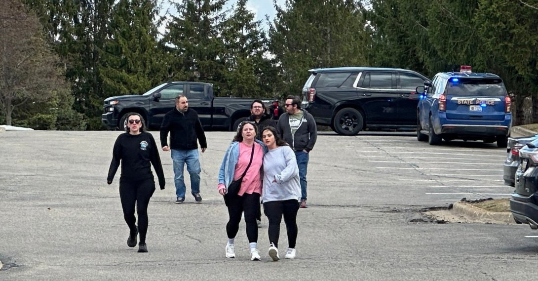 People gather near Temple Israel synagogue in West Bloomfield Township, Mich. (AP Photo)