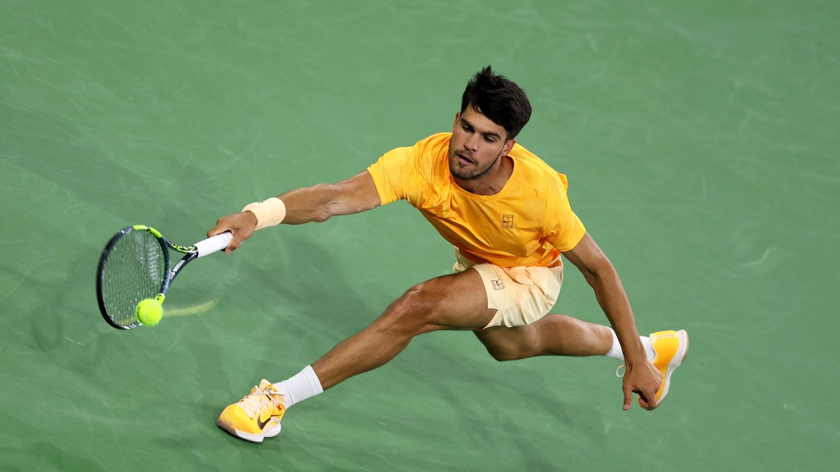 Spain's Carlos Alcaraz plays a forehand against Great Britain's Cameron Norrie in their quarterfinal match of the BNP Paribas Open at Indian Wells Tennis Garden, Indian Wells, U.S., March 12, 2026. (AFP Photo)