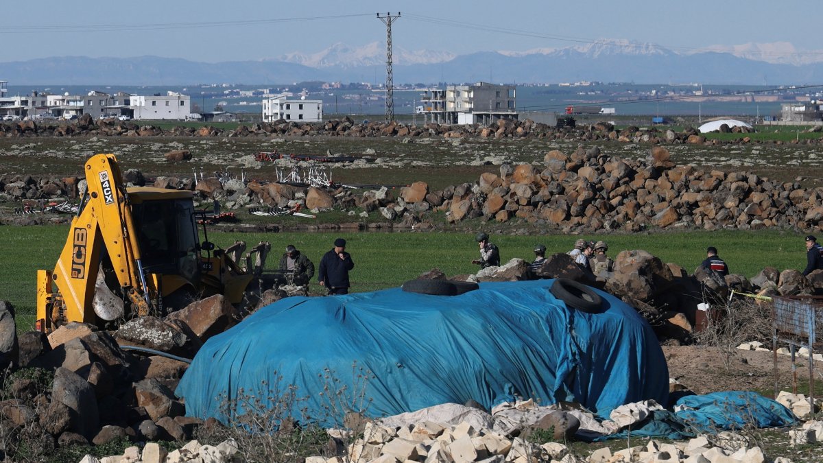 Turkish army personnel search a field after a piece of ammunition fell following the interception of a missile launched from Iran by a NATO air defense system, Diyarbakır, Türkiye, March 9, 2026. (Reuters Photo)
