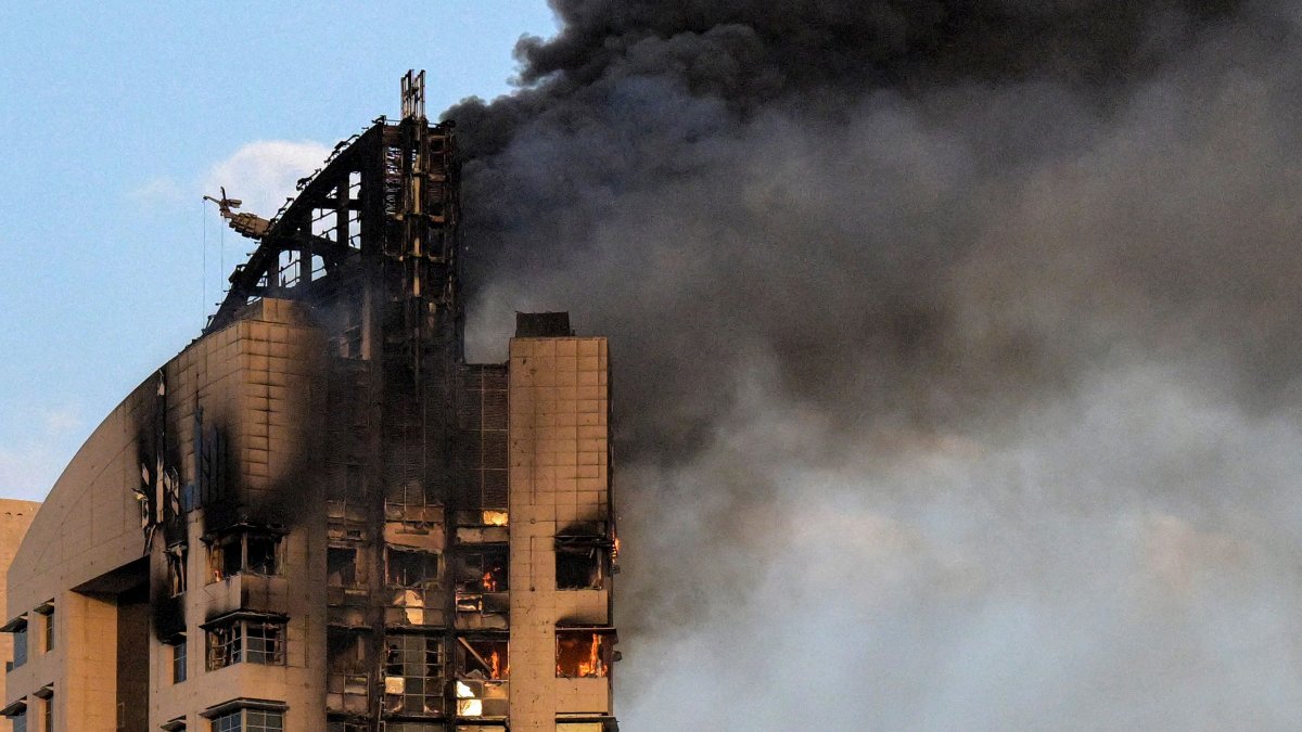 Smoke rises from a high-rise building following a drone attack in Kuwait City, Kuwait, March 8, 2026. (AFP Photo)
