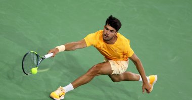 Spain's Carlos Alcaraz plays a forehand against Great Britain's Cameron Norrie in their quarterfinal match of the BNP Paribas Open at Indian Wells Tennis Garden, Indian Wells, U.S., March 12, 2026. (AFP Photo)