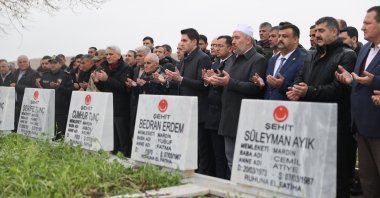 People attend a memorial ceremony for eight people killed by PKK terrorists on March 7, 1987, at a martyrs’ cemetery in the rural Açıkyol neighborhood of Nusaybin, Mardin province, Türkiye, March 7, 2026. (AA Photo)