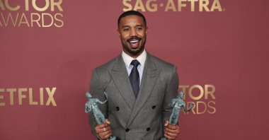 Michael B. Jordan poses with the Outstanding Performance by a Male Actor in a Leading Role award and the Outstanding Performance by a Cast in a Motion Picture award for "Sinners" during the Actor Awards, in Los Angeles, California, U.S., March 1, 2026. (Reuters Photo)