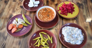Dried beans served with mezes and pickles, Nevşehir, Türkiye, Dec. 3, 2025. (AA Photo)