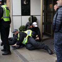 A person is detained on the day of a static protest to mark Al-Quds Day in support of the Palestinian people organised by the Islamic Human Rights Commission and a counter-protest, in London, Britain, March 15, 2026. (Reuters Photo)