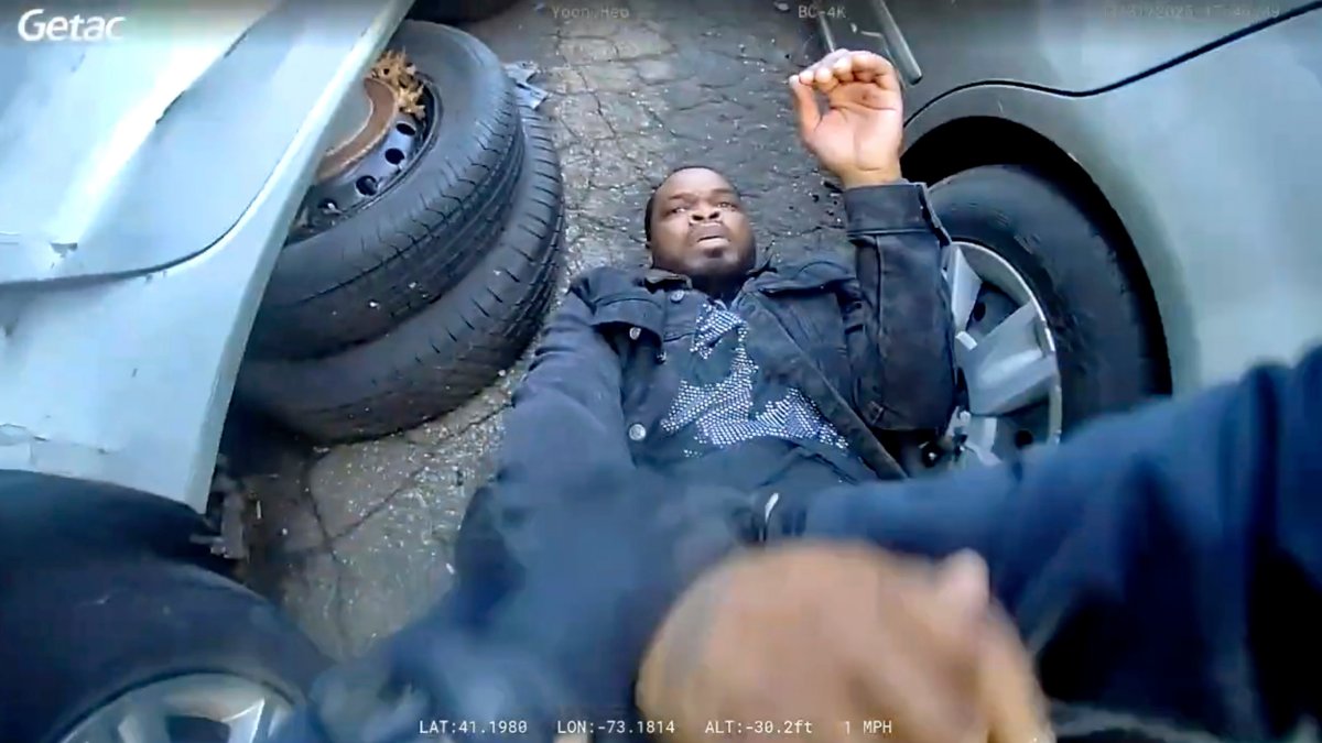 In this photo taken from video released by the Bridgeport Police Department, Dyshan Best looks up at Bridgeport Police officer Yoon Heo after being shot by Heo during a chase, Bridgeport, Conn., U.S., March 31, 2025. (AP Photo)