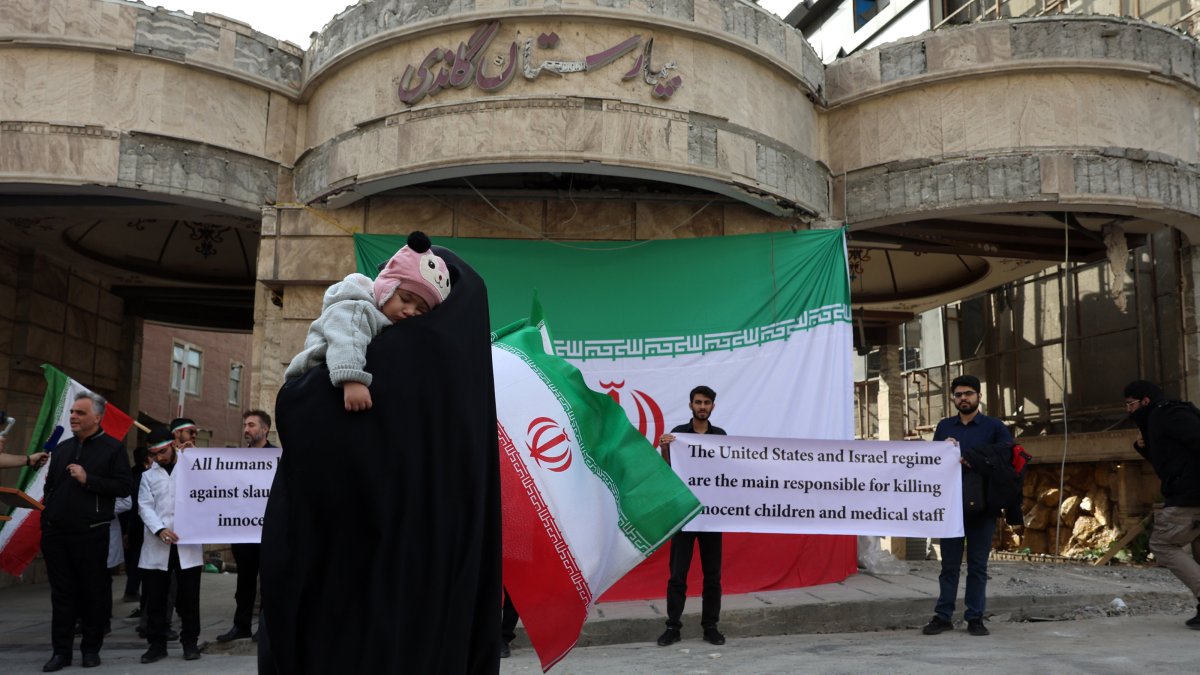 Medical personnel take part in a protest in front of the destroyed Gandhi Hospital by a U.S.-Israel airstrike, Tehran, Iran, March 7, 2026. (EPA Photo)