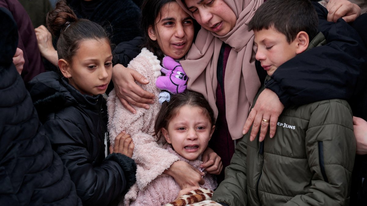 A child cries as mourners carry the bodies of a Palestinian family, the parents and their two children killed in an Israeli raid, in Tammoun town near Tubas, Israeli-occupied West Bank, Palestine, March 15, 2026. (Reuters Photo)