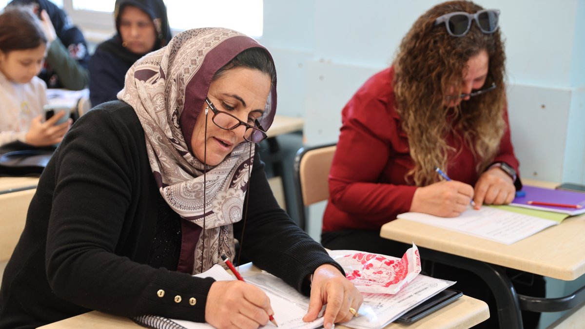 Yüksel (L) and Zeliha Boğaakça attend a literacy class together, practicing reading and writing, Şanlıurfa, Türkiye, March 15, 2026. (AA Photo) 