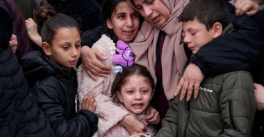 A child cries as mourners carry the bodies of a Palestinian family, the parents and their two children killed in an Israeli raid, in Tammoun town near Tubas, Israeli-occupied West Bank, Palestine, March 15, 2026. (Reuters Photo)