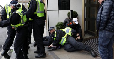 A person is detained on the day of a static protest to mark Al-Quds Day in support of the Palestinian people organised by the Islamic Human Rights Commission and a counter-protest, in London, Britain, March 15, 2026. (Reuters Photo)