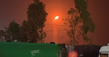 A gas flare burns at the Lanaz refinery after it was targeted by a drone strike, in Erbil, Iraq, March 14, 2026. (Reuters Photo)